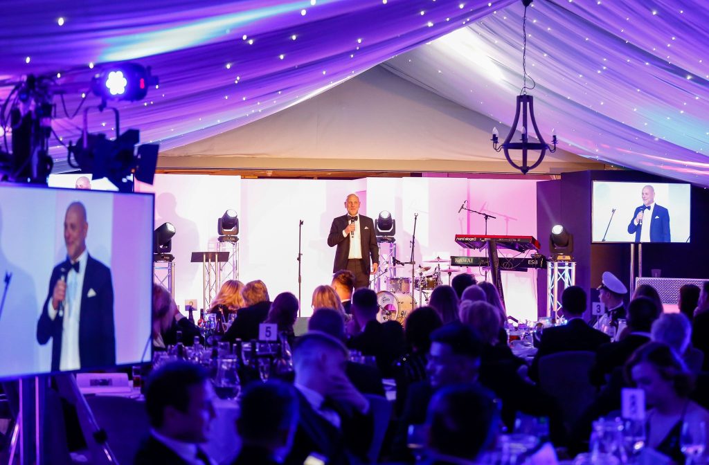Andy Foote, Fetcher Dog Charity Chairman presenting on stage at the annual gala dinner at Hogarths hotel